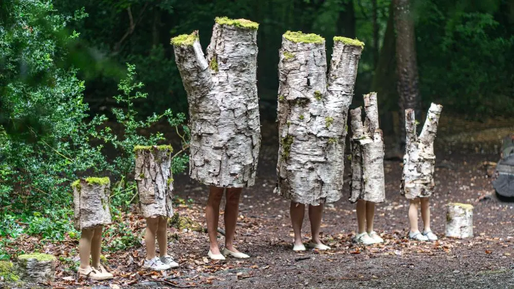 Olana Light's art six tree people standing in the woods