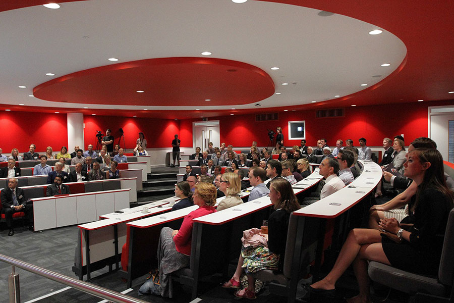 SAtff and students sat in the Palmerston Lecture Theatre