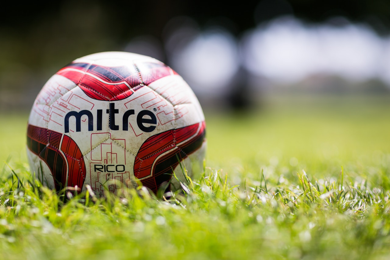 A Mitre football in the grass at Hampshire FA