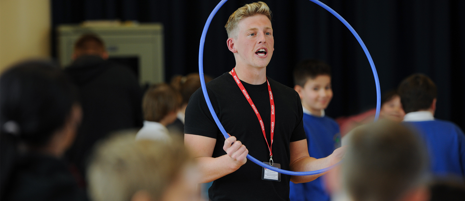 Student teaches children PE