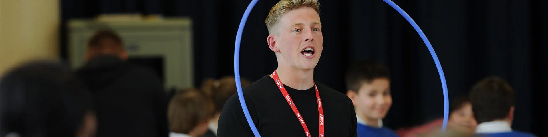 Student teaches children PE