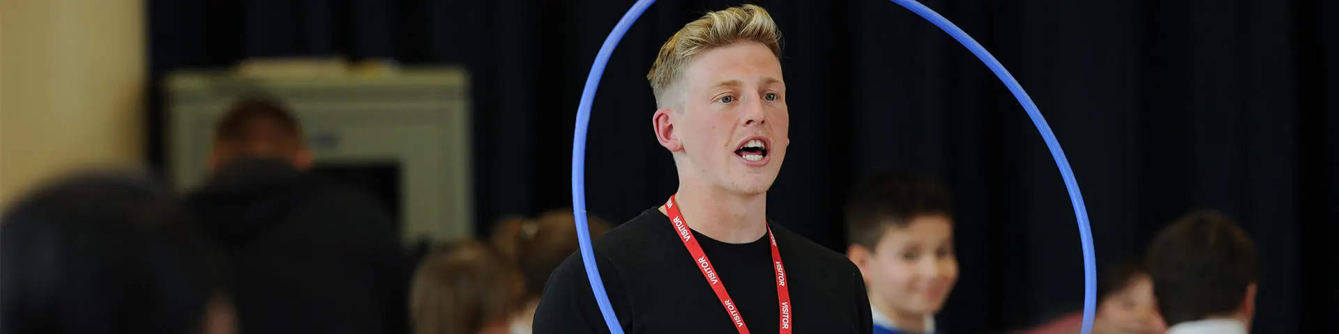 Student teaches children PE