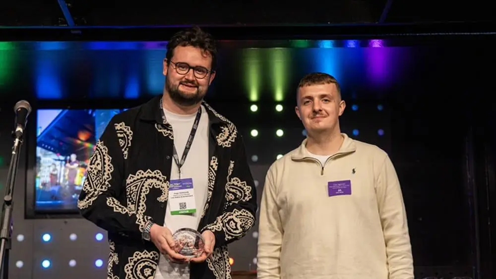 (l-R) Hugo receiving his 30 under 30 award from Gus, Marketing Director for Access All Areas