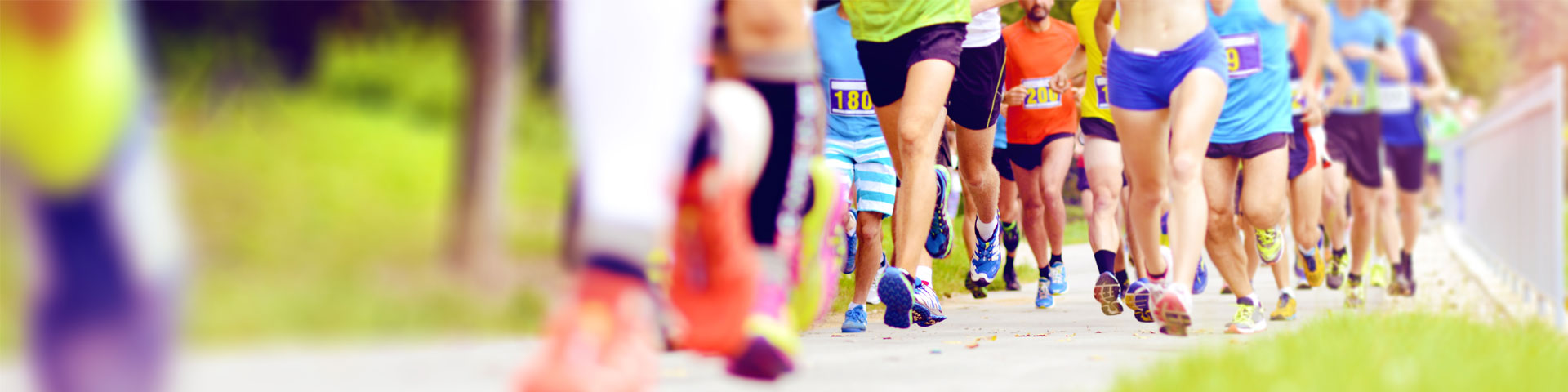 Close-up of people running along a path