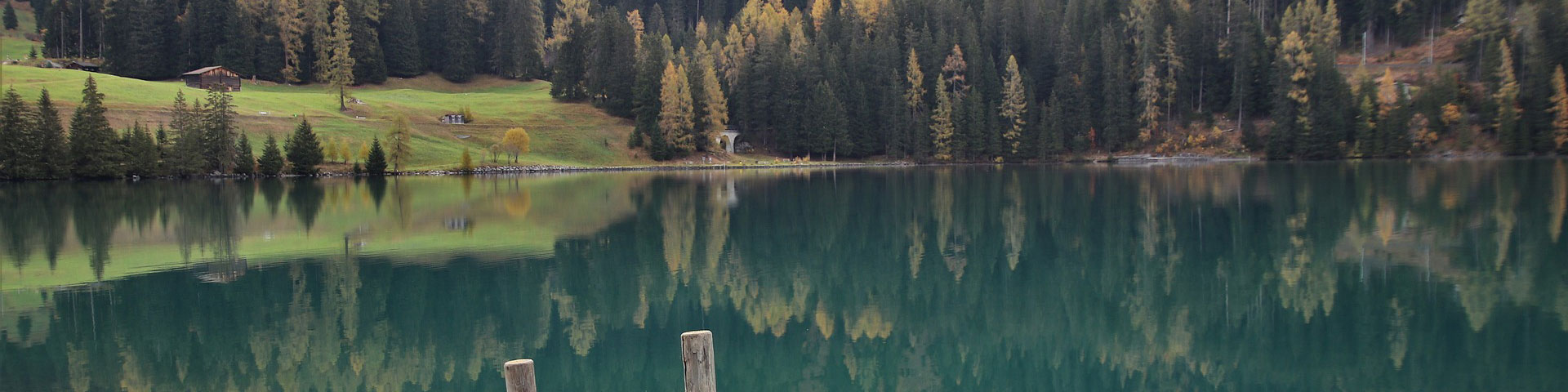 A lake with a little boat on