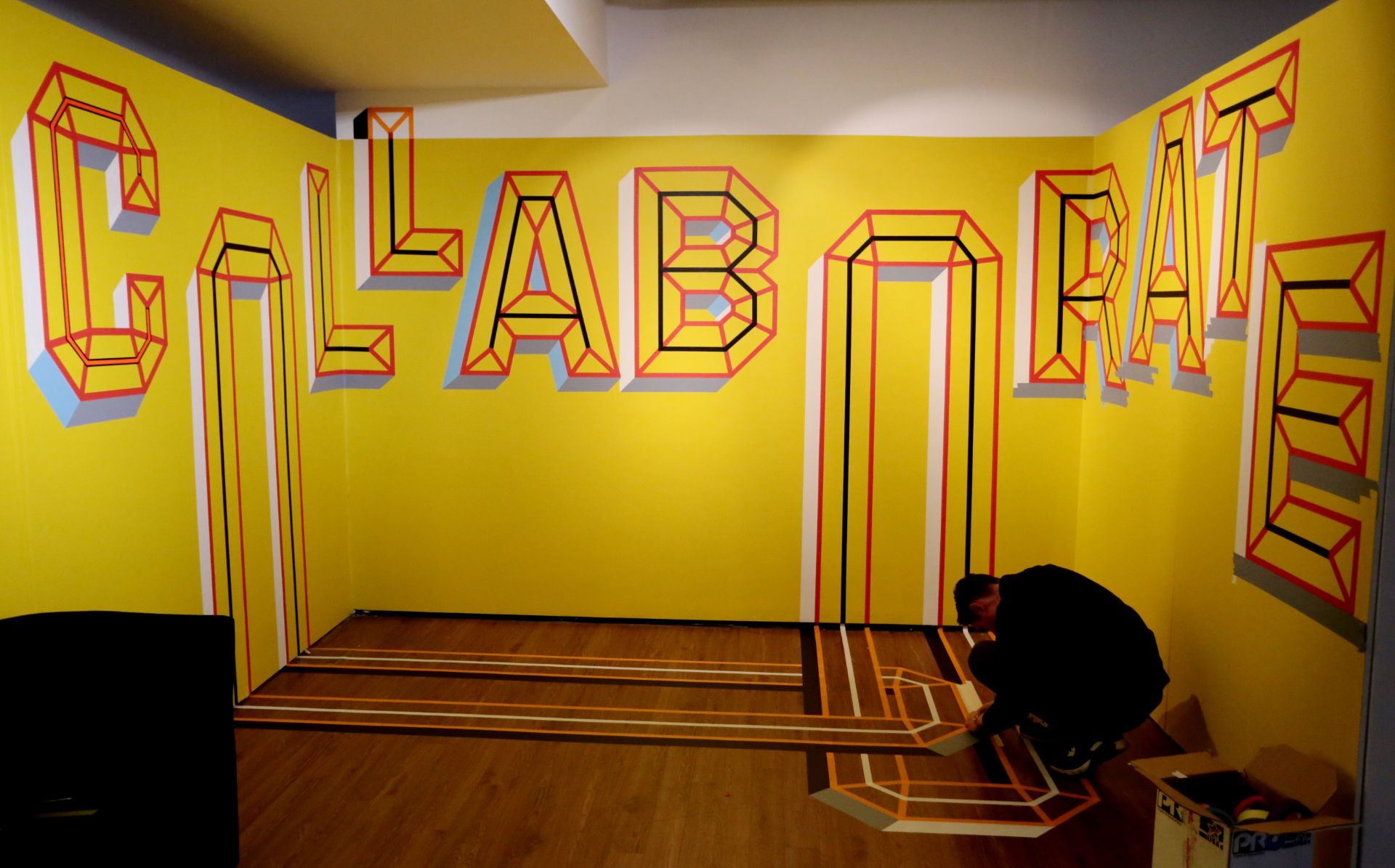 Picture shows artwork by artist Nathan Evans, and reads the words Collaborate