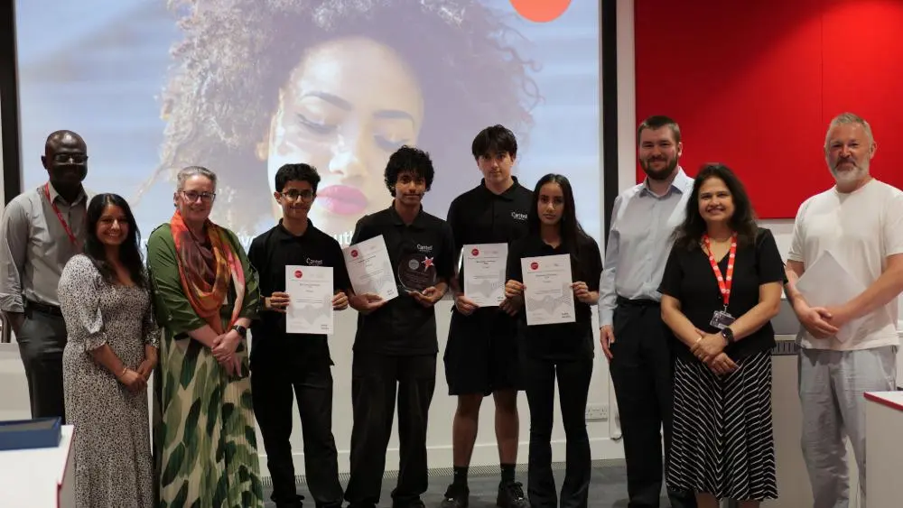 Solent Business Challenge Winners standing alongside Solent and school staff 