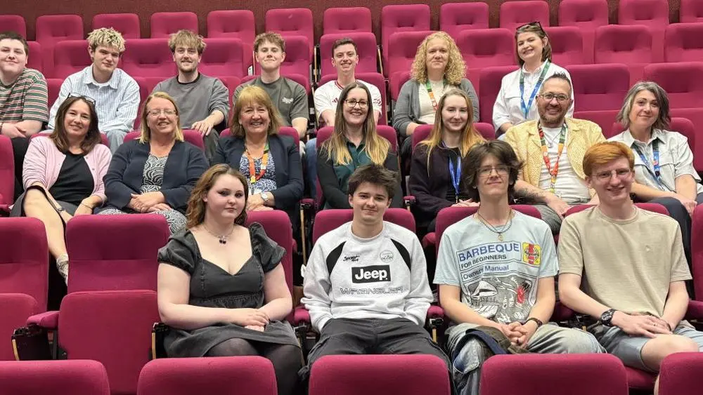 Students with staff and NHS representatives at the films screening