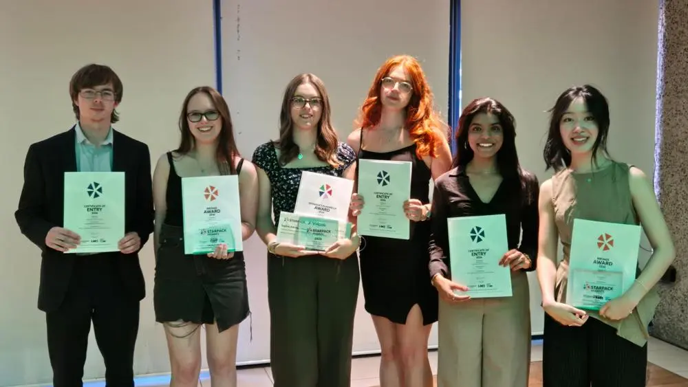 students standing with starpack student awards