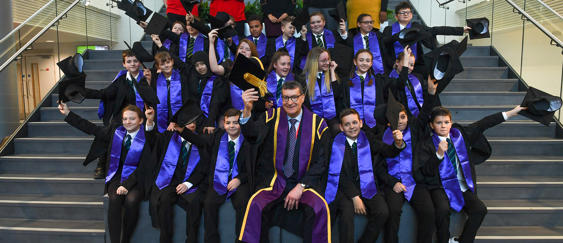 VC and pupils celebrating graduating