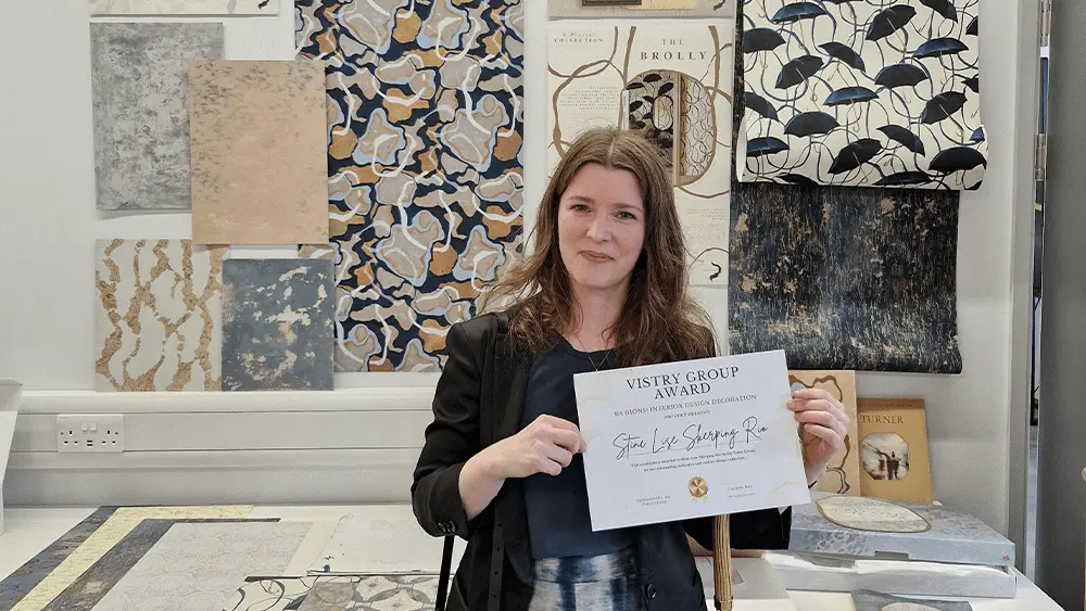 Stine Lise Skjerping Rio stood with the Vistry Homes Award certificate.