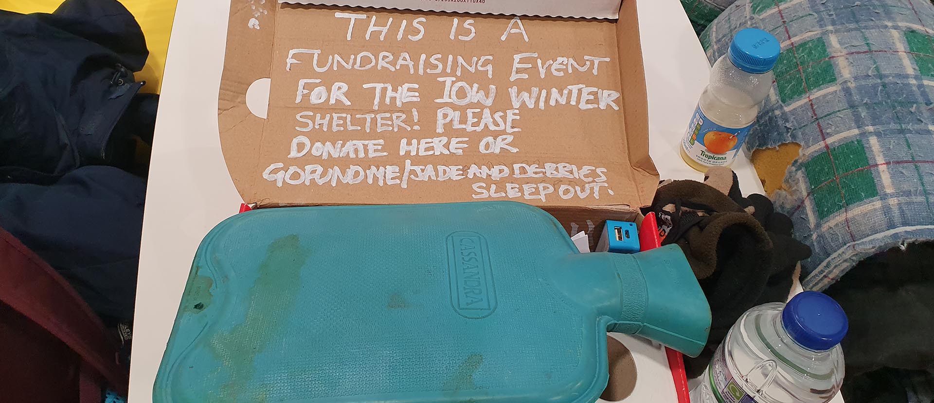 Sleepout kit including a hot water bottle and water