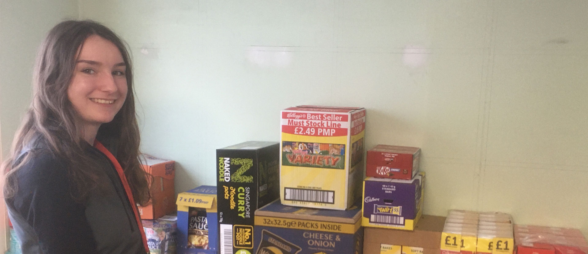 A member of the student residences team with some of the food supplies for students