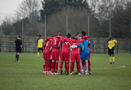Team Solent Football team in a huddle