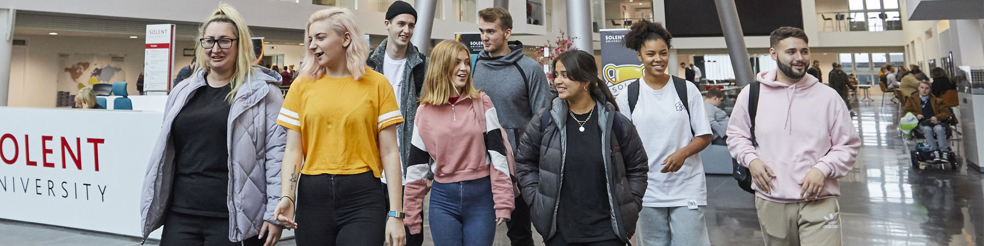 A group of students walking through the Spark