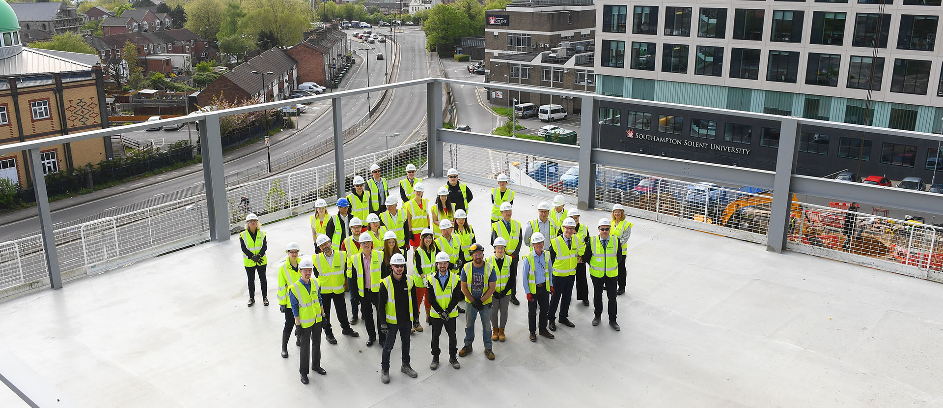 Staff and students on top of the new sports building