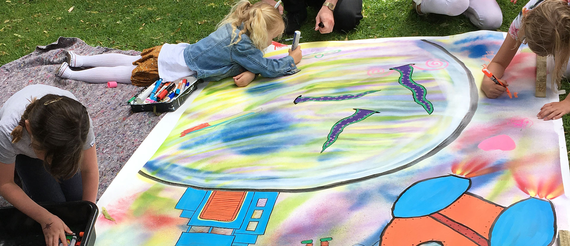 Children painting on the ground