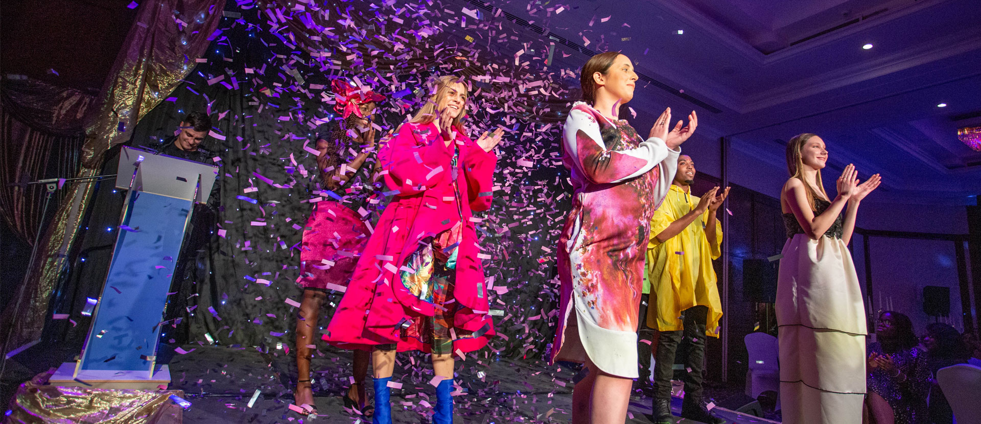 Models on the catwalk wearing clothes designed by Solent University students