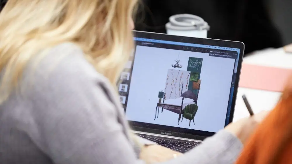Interior Design student designing on a laptop