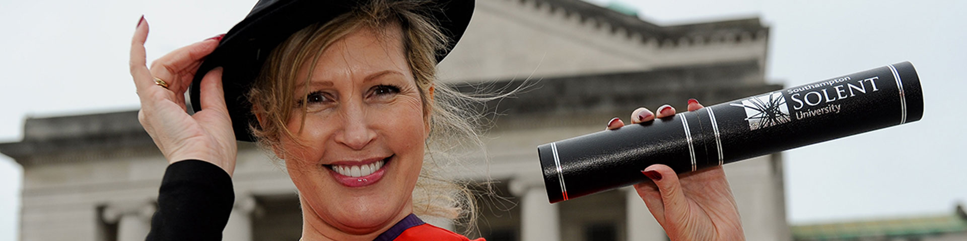 Vanessa Brady with her degree outside the Guildhall