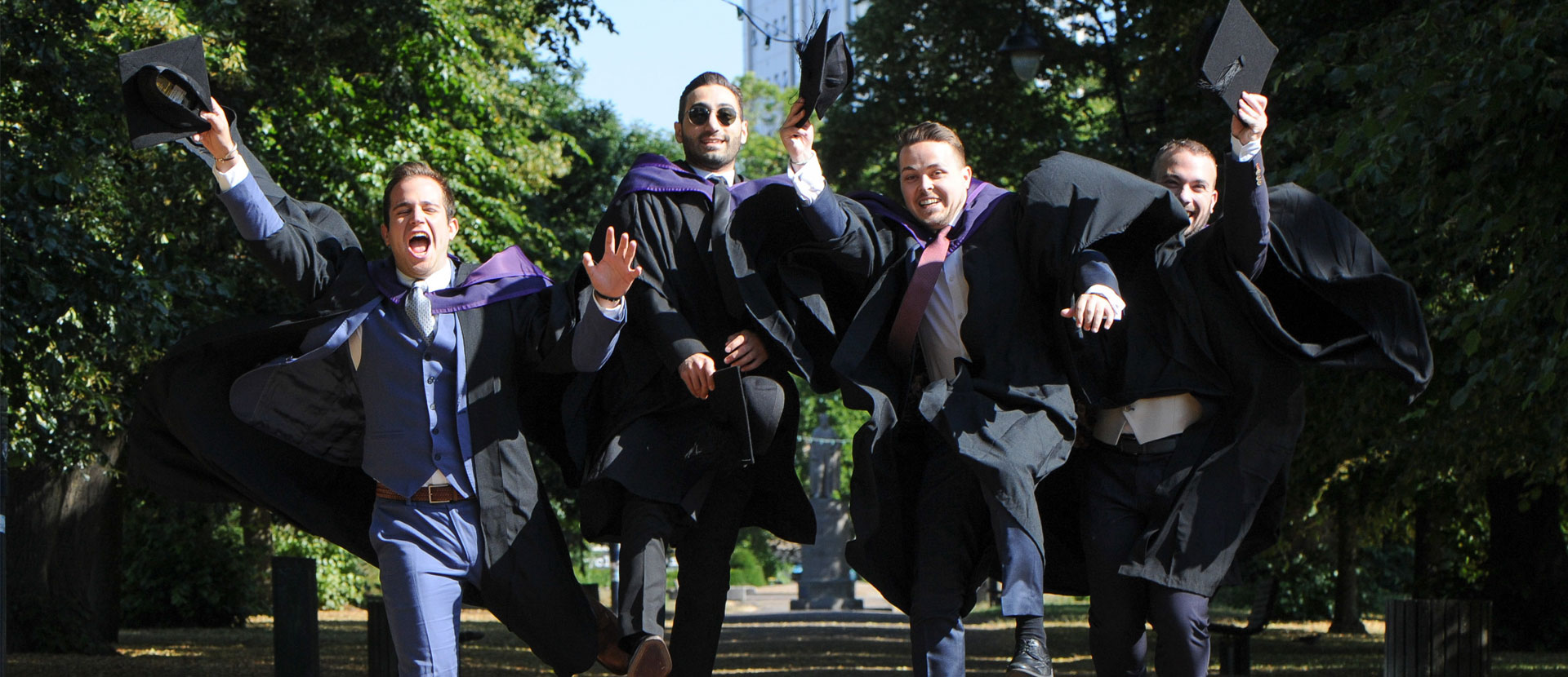Solent graduates jumping in the air