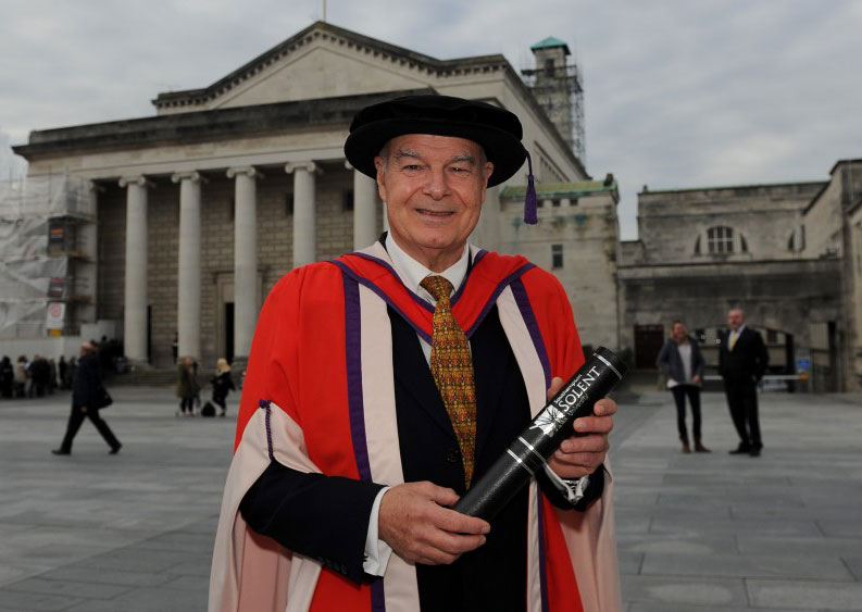 Ken Robinson with his honorary degree outside the Guildhall in Southampton