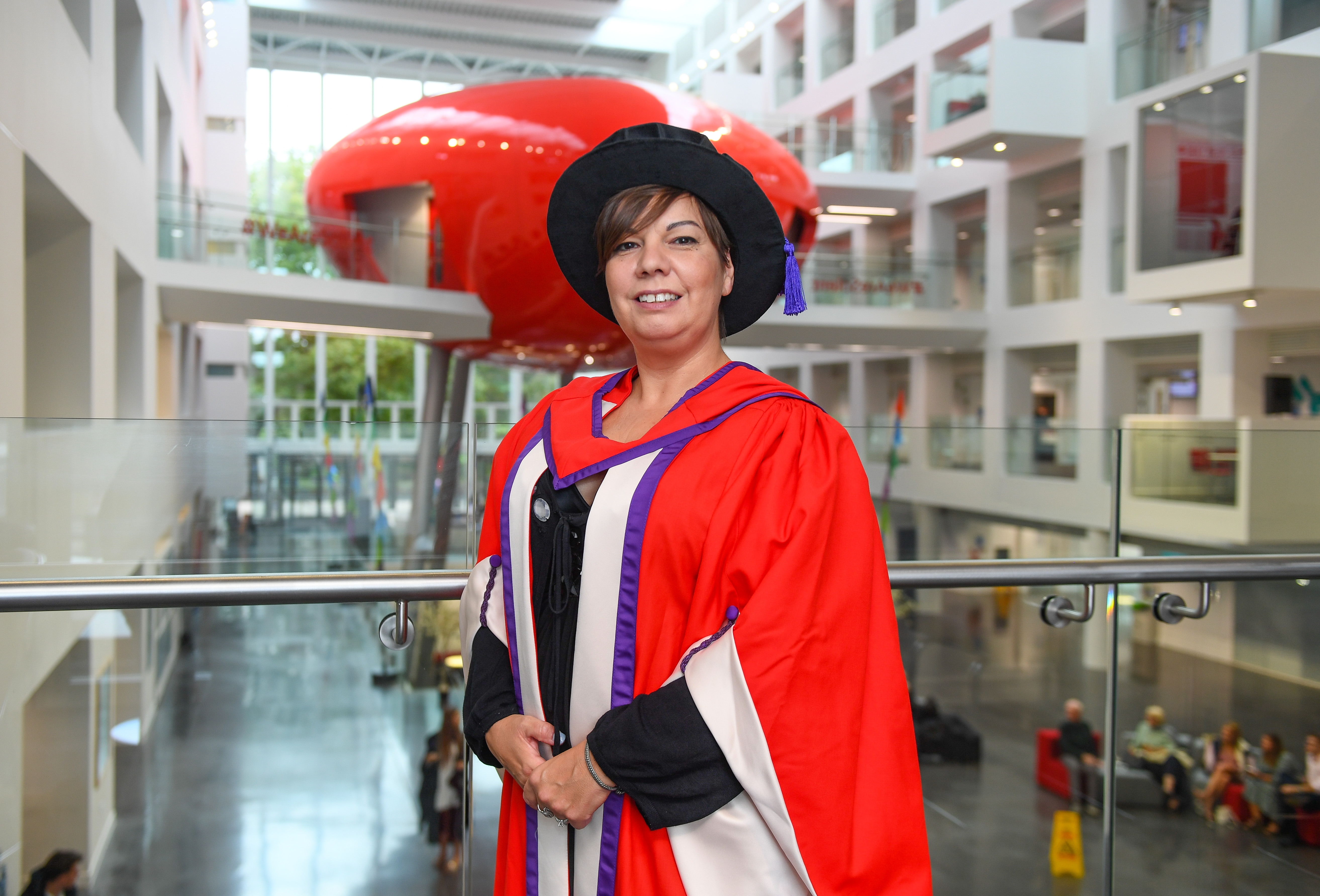 Nina Hartstone in her ceremonial gown in front of the Pod in The Spark