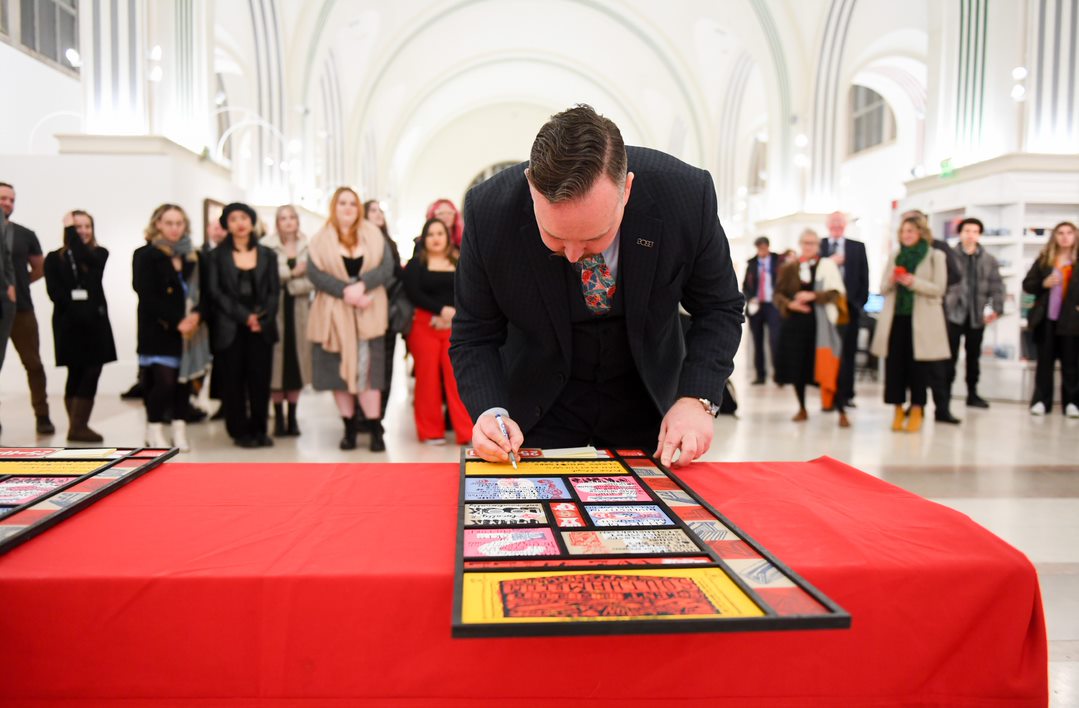 Professor Pete Lloyd signing the manifesto