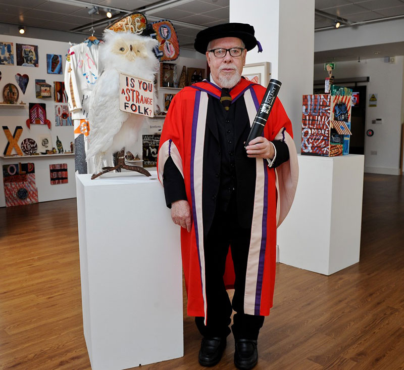 Sir Peter Blake with his honorary degree in Solent's Below Bar studios