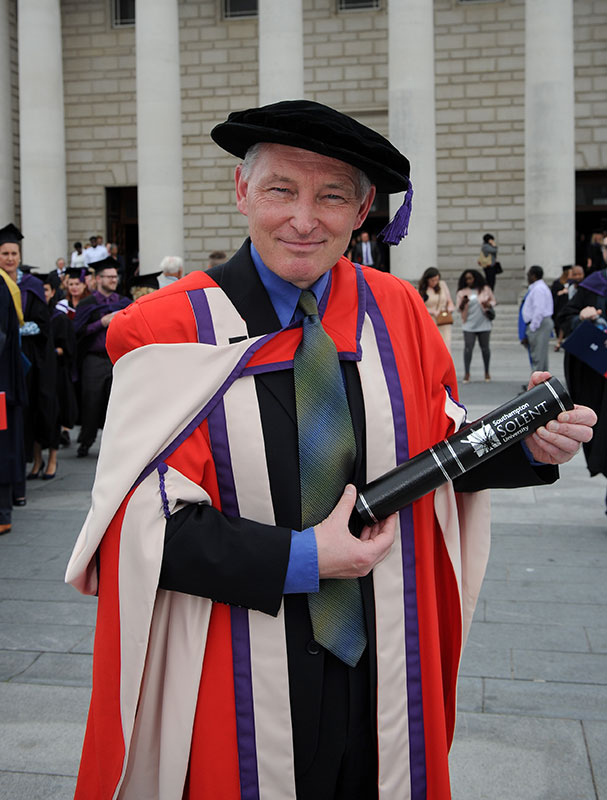 Phil McNulty with his degree outside the Guildhall