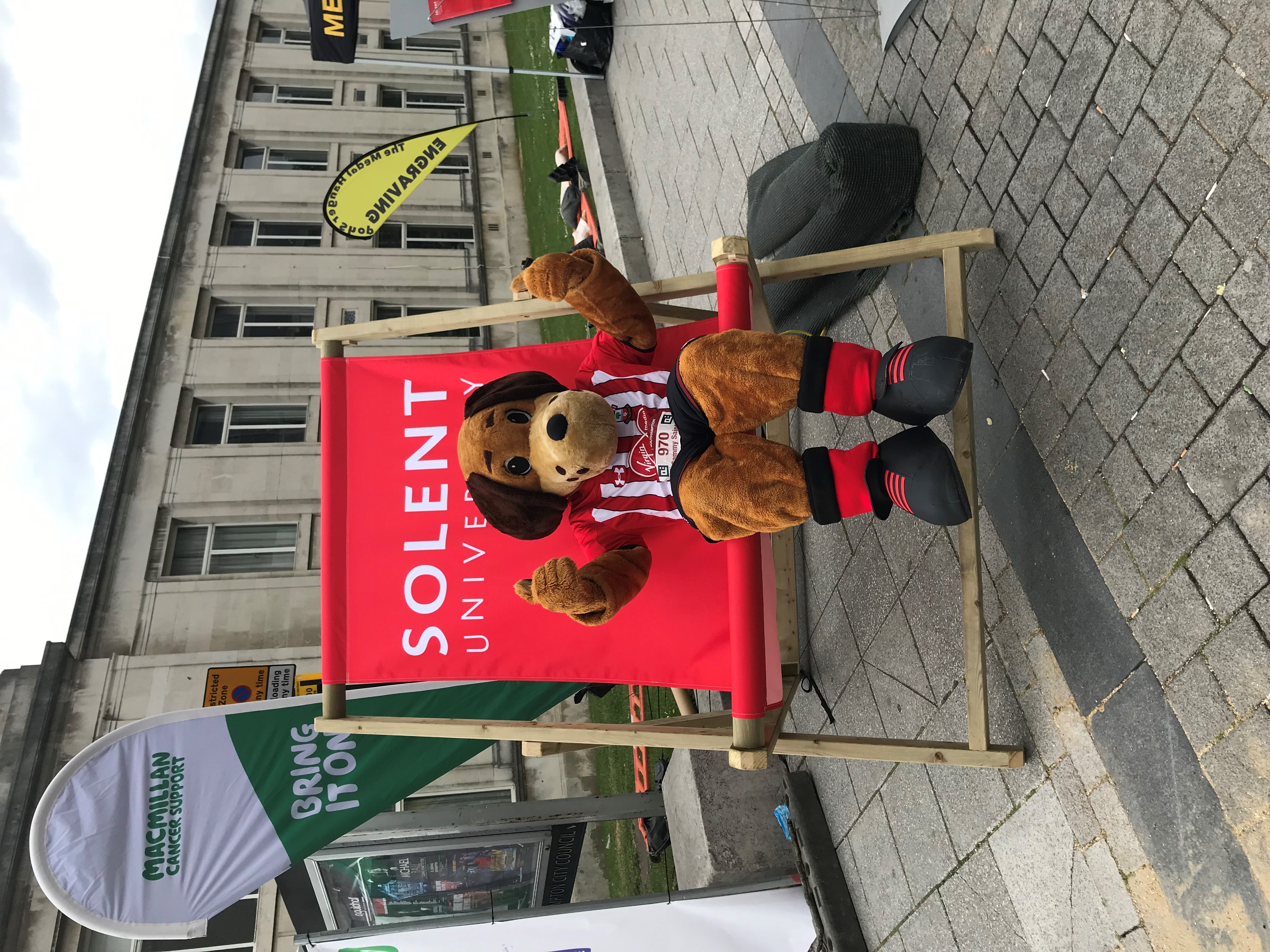 Sammy Saint sitting on the Solent University deck chair in 2019