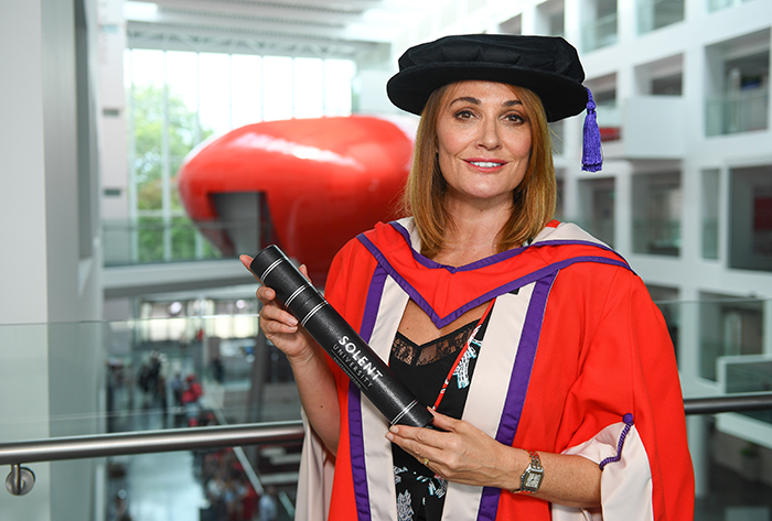Sarah Parish with her degree in The Spark