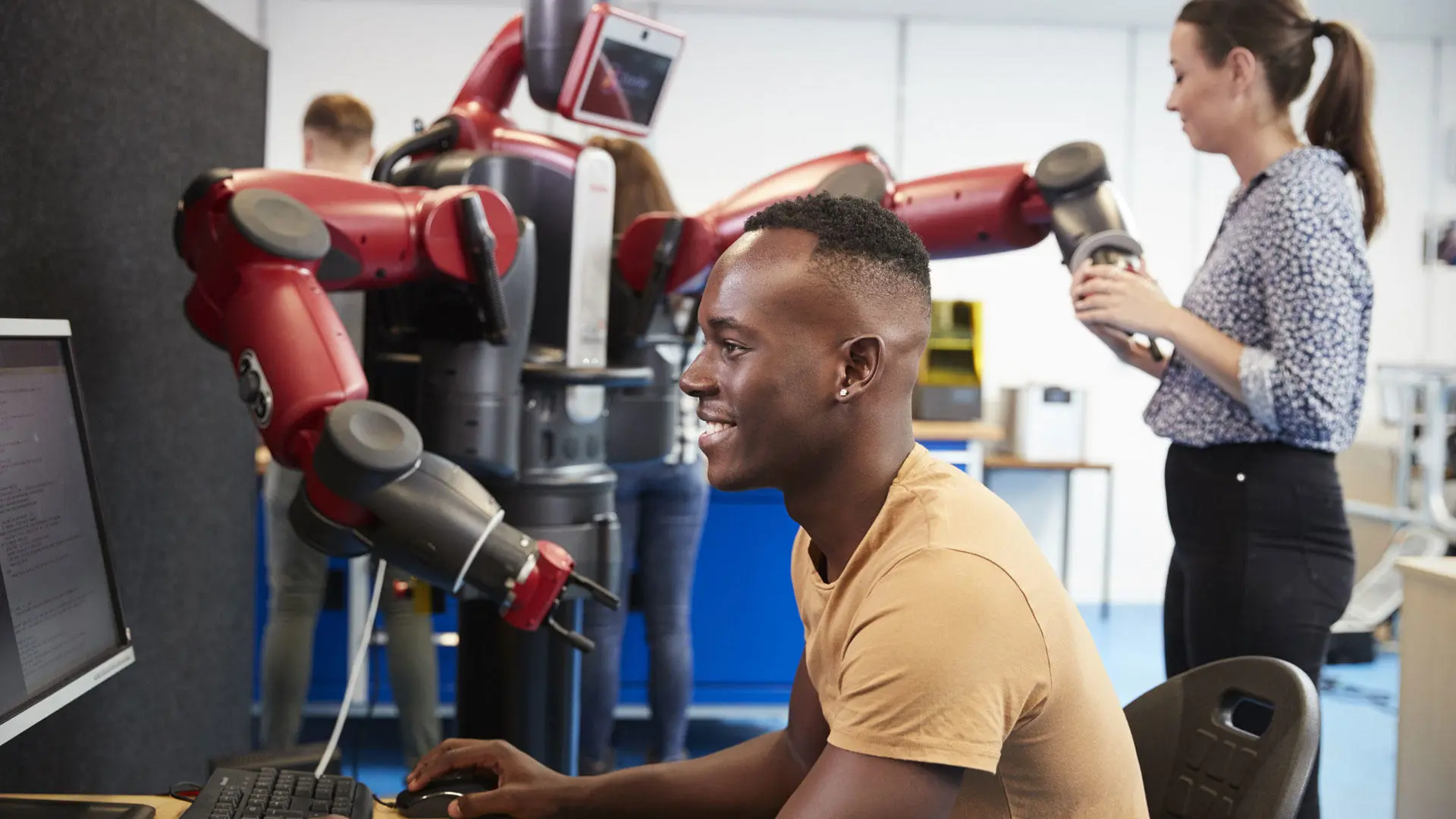 Students working with the Baxter robot