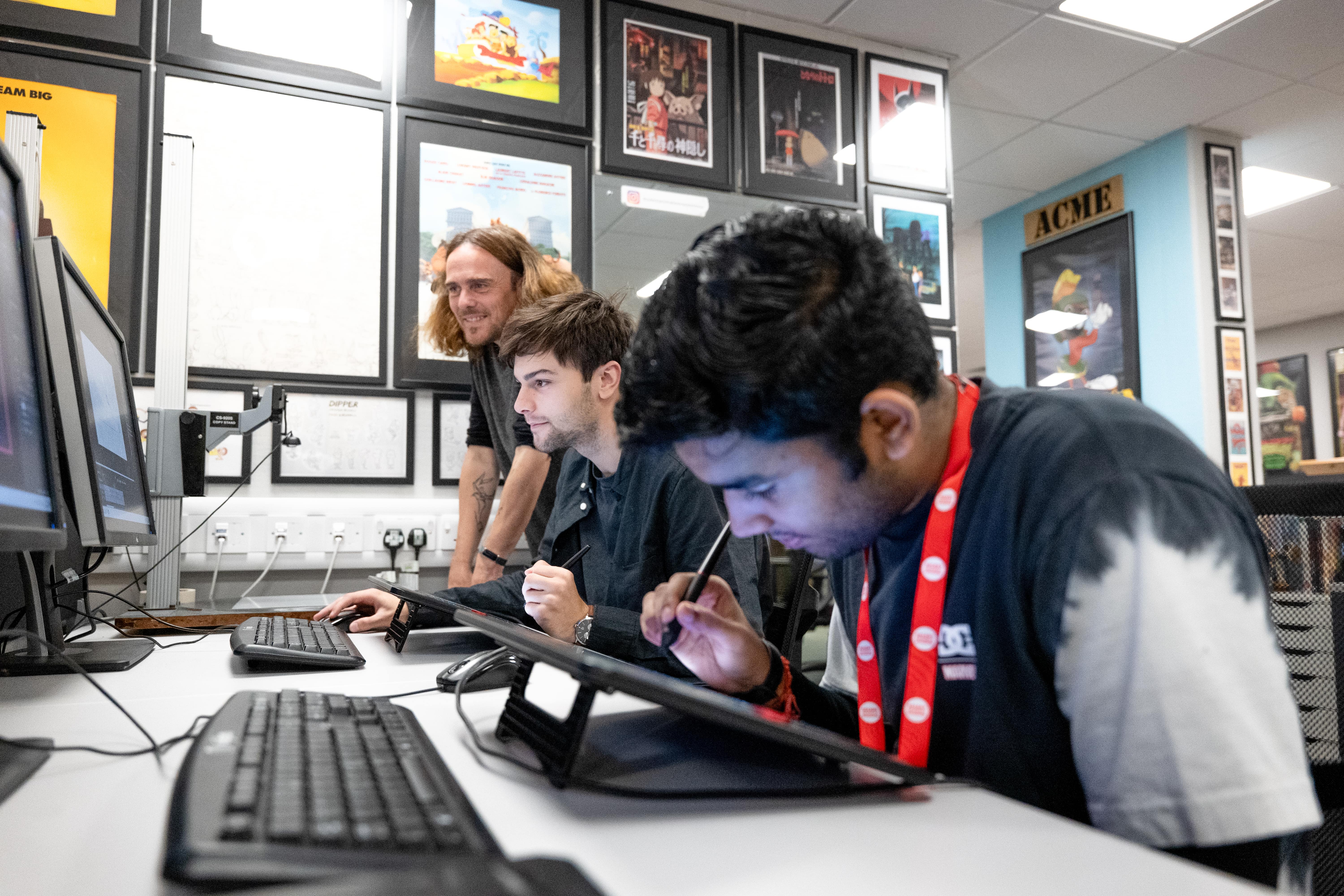 Student using graphics tablets to create animation