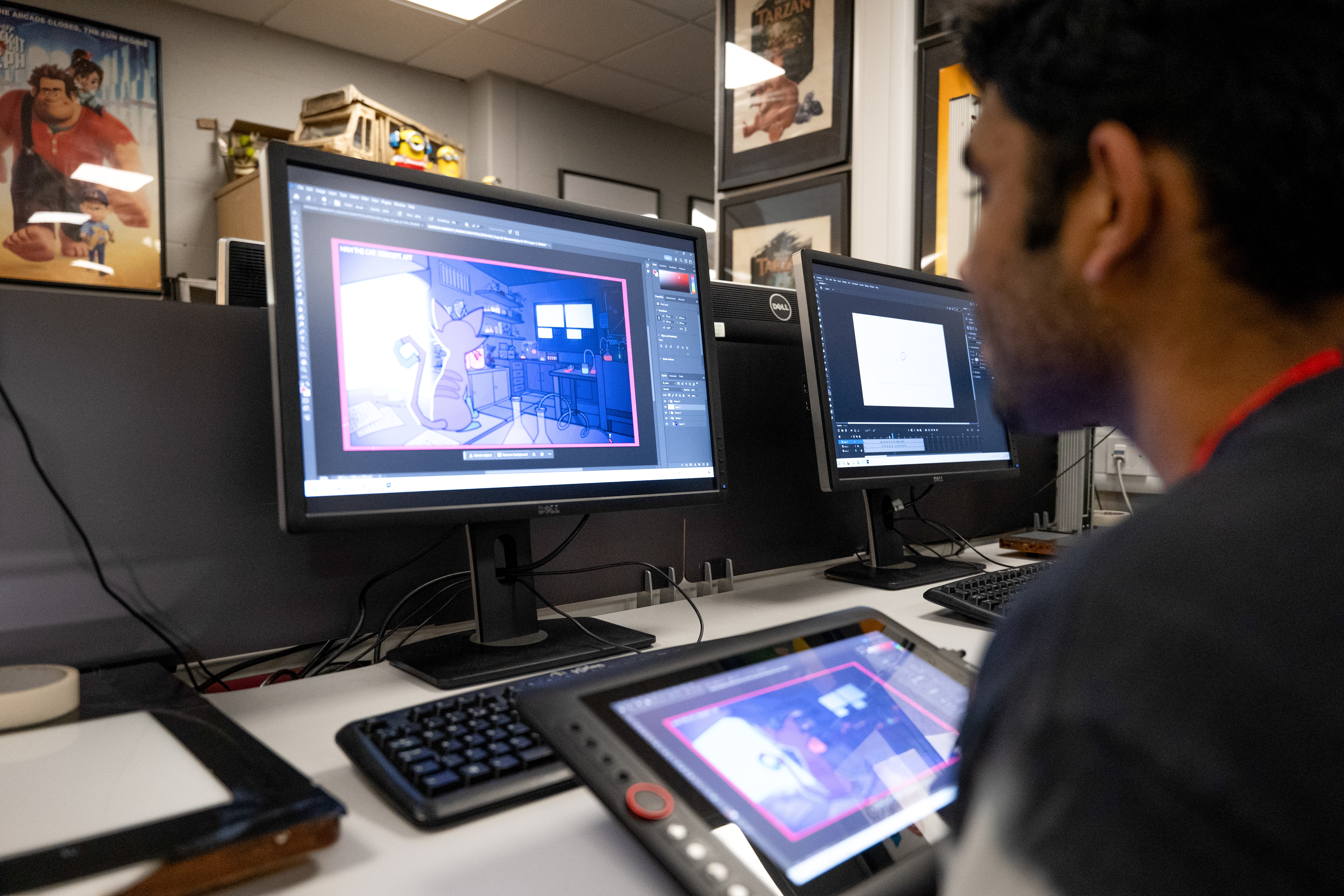 Student working on digital animation using a graphics tablet