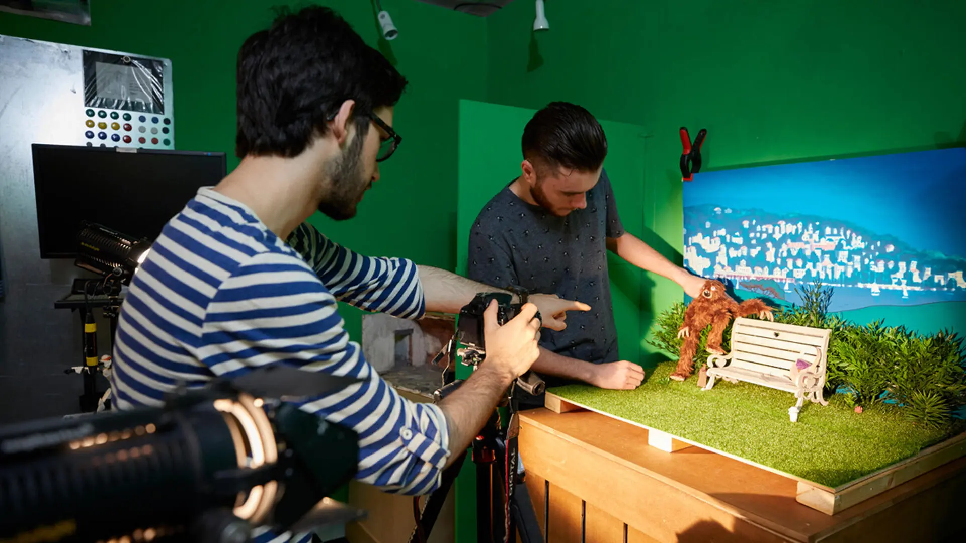 Animation students setting up stop-motion animation of an orang-utan