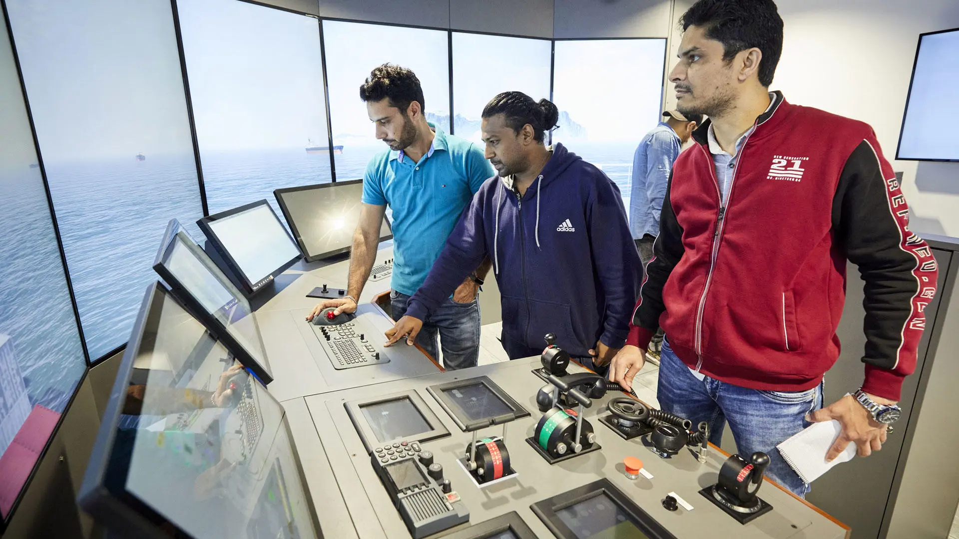 Officer of the watch students using the bridge simulator