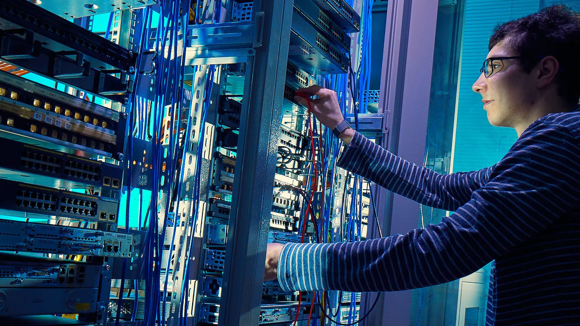 A person working on a server system