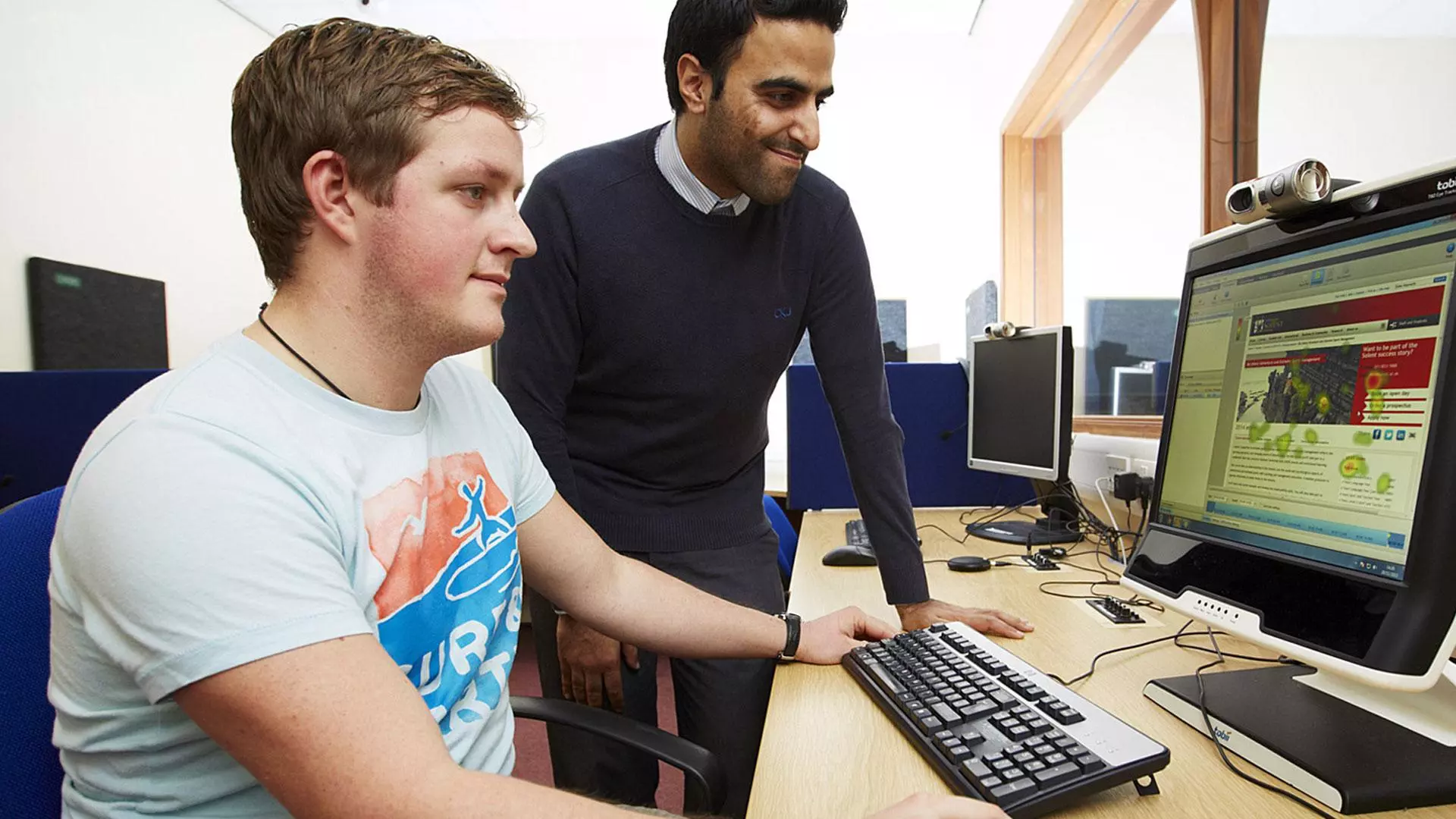 Student with an instructor in the usability lab