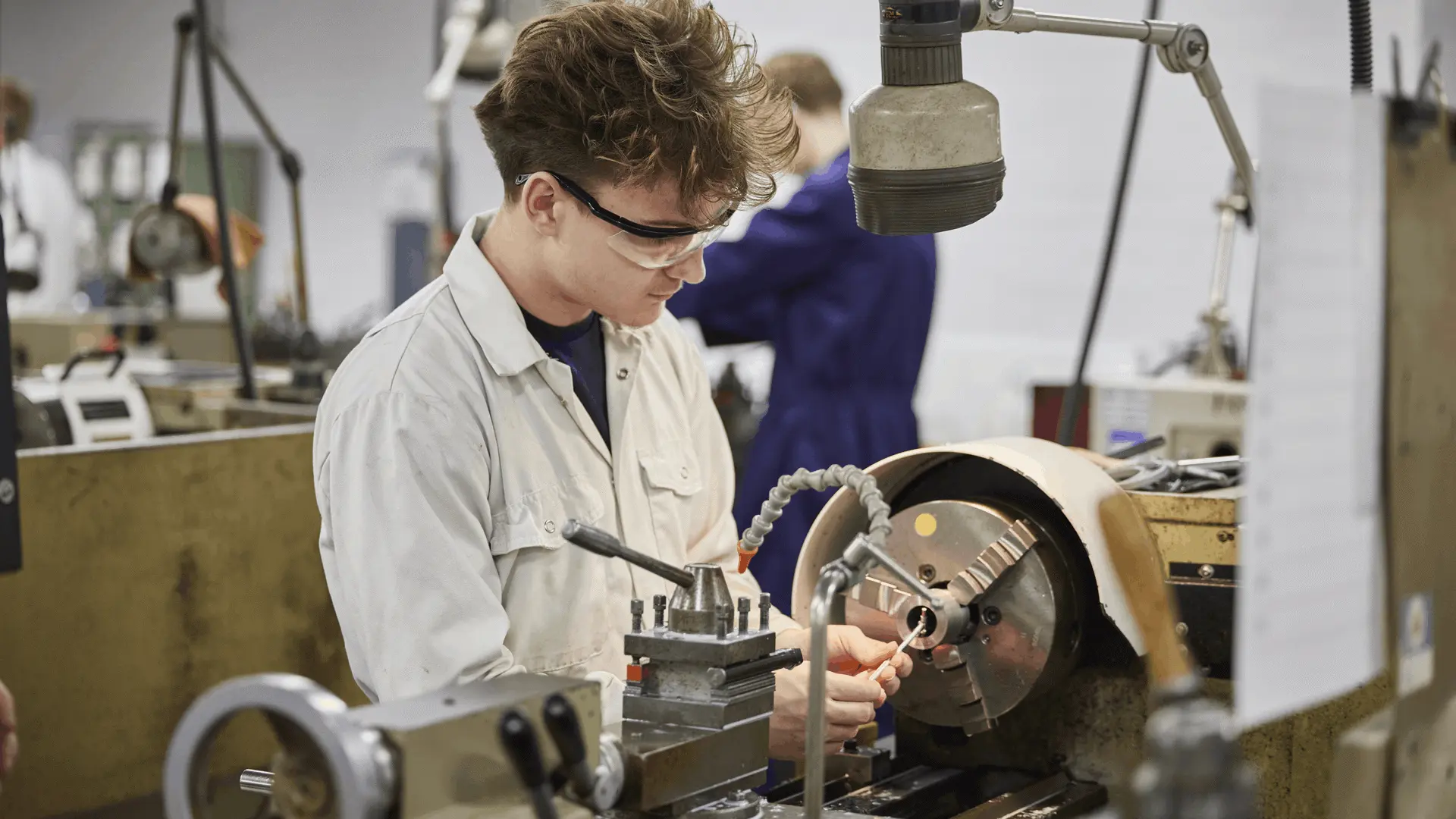 A student at a workstation in the marine engineering workshop
