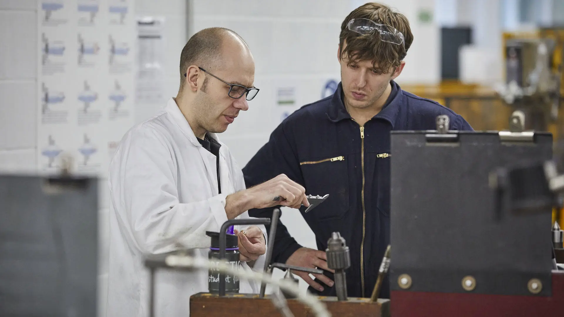 Engineer cadet with an instructor in the marine engineering workshops