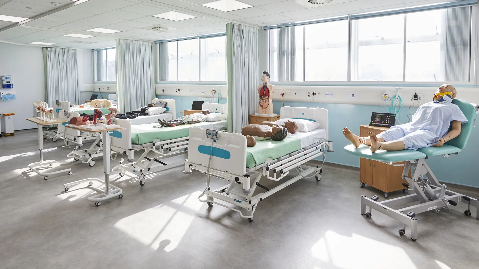 Wide shot showing the beds in the nursing simulation suite