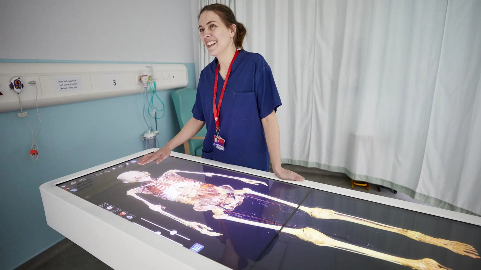 A nursing lecturer with one of the simulation facilities