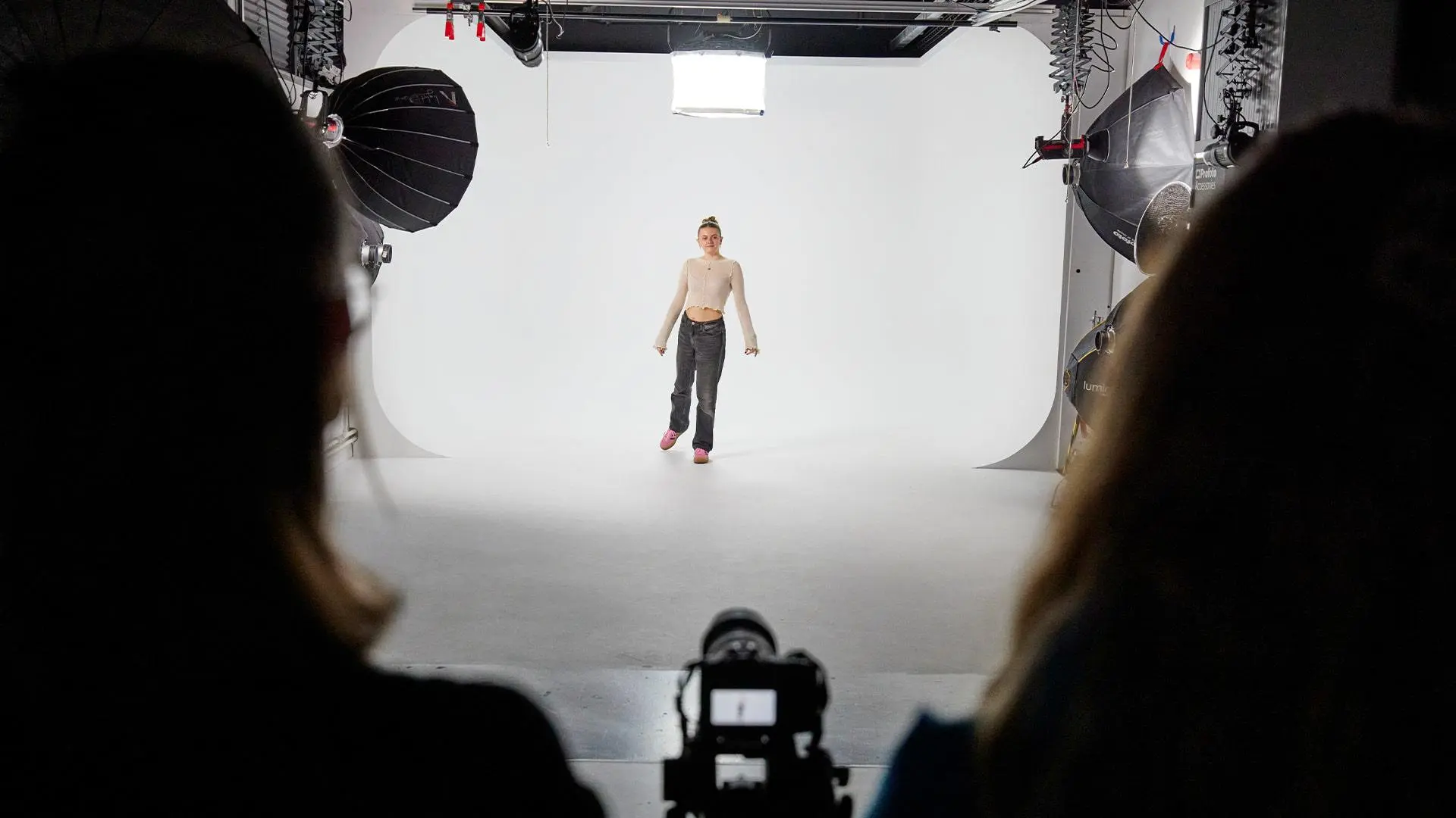 Image of a model being photographed in the cover photography studio
