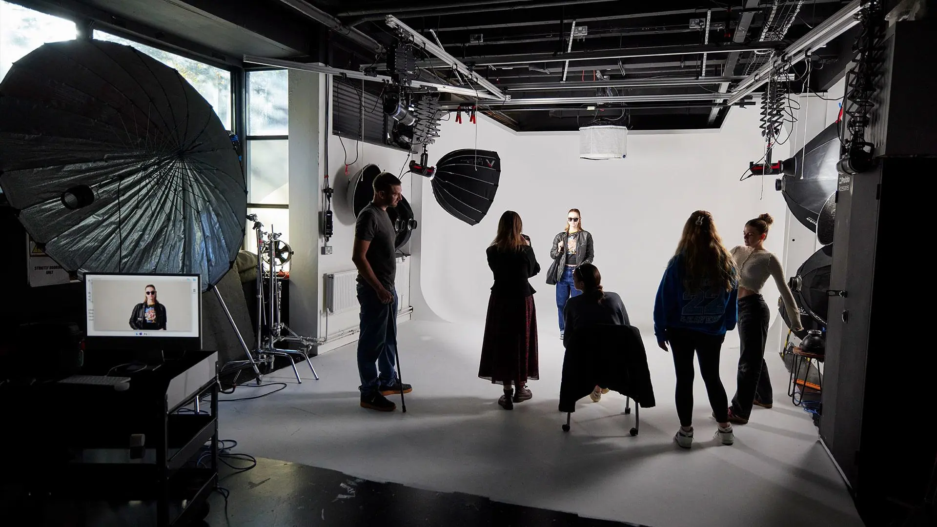 Students working in the cove photography studio