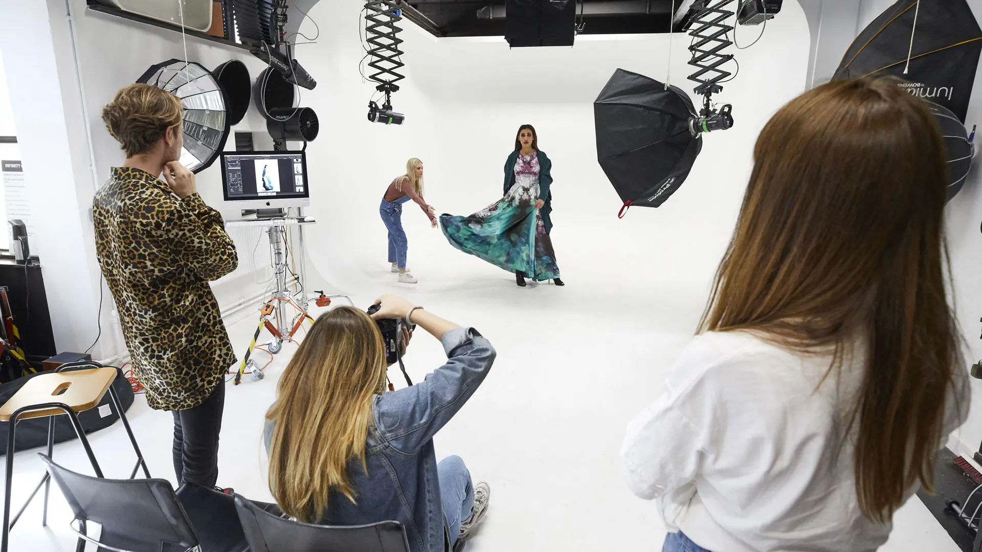 Students doing a photoshoot in the photography studio