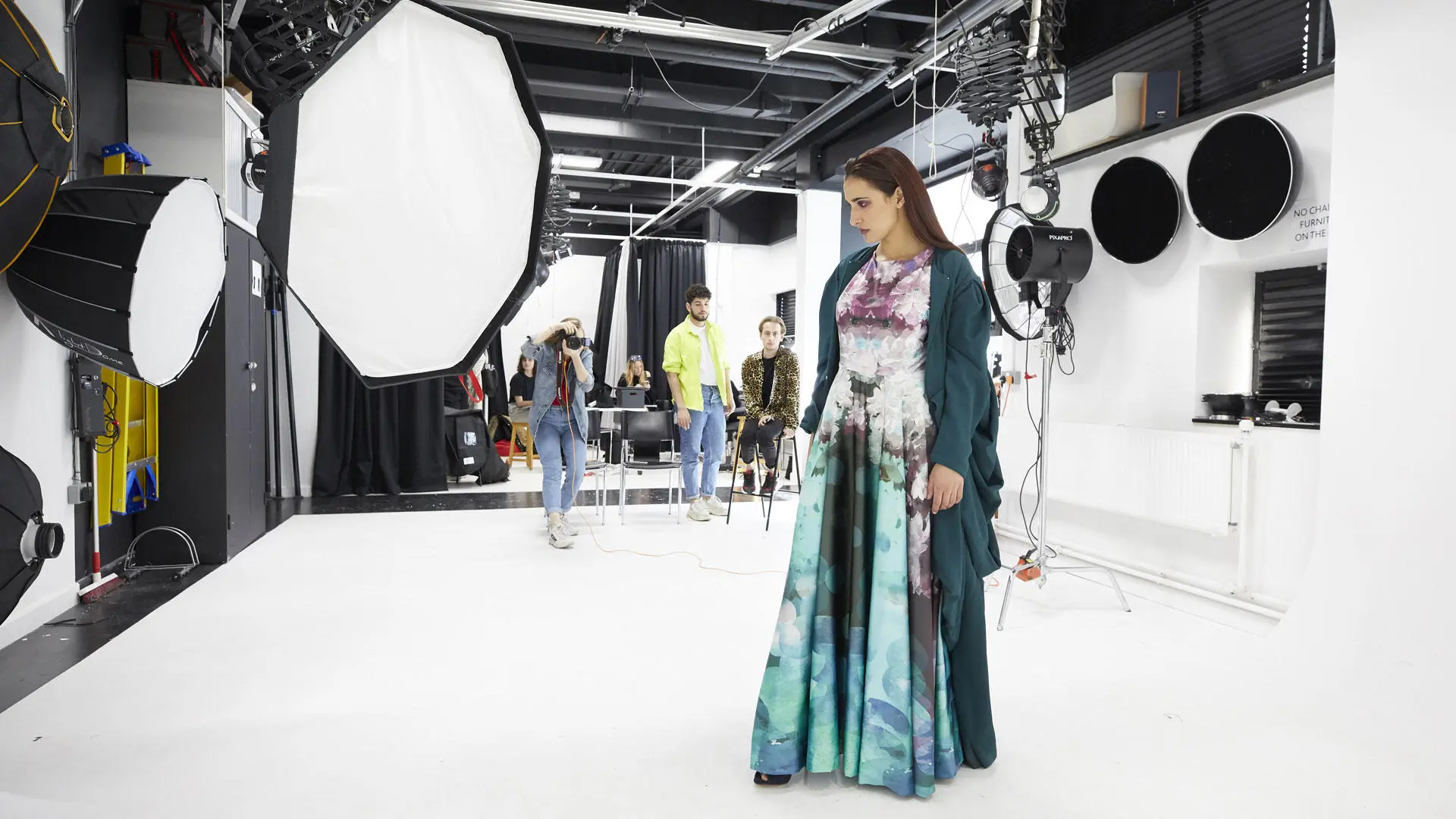 Students doing a photoshoot in the photography studio
