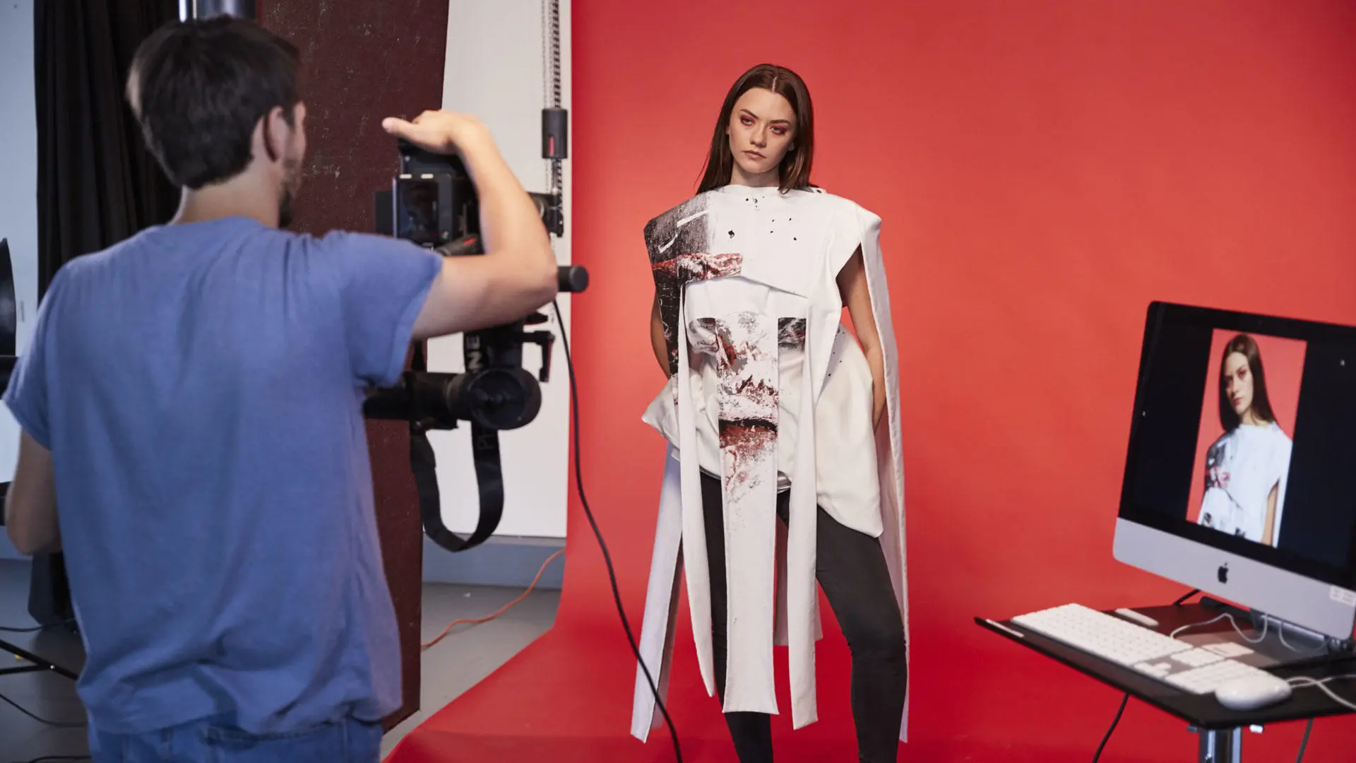 Students doing a photoshoot in the photography studio