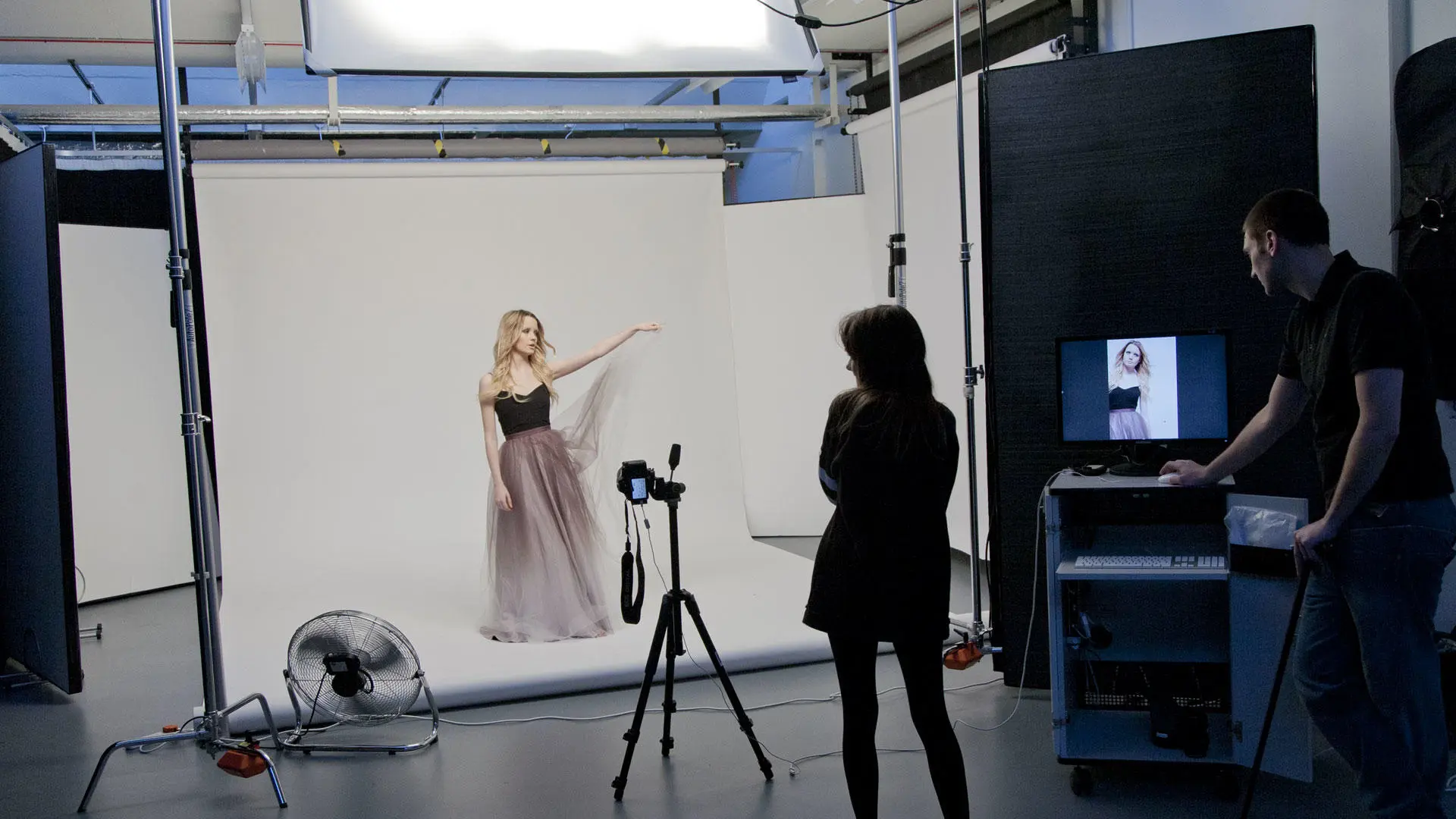 Students doing a photoshoot in the photography studio