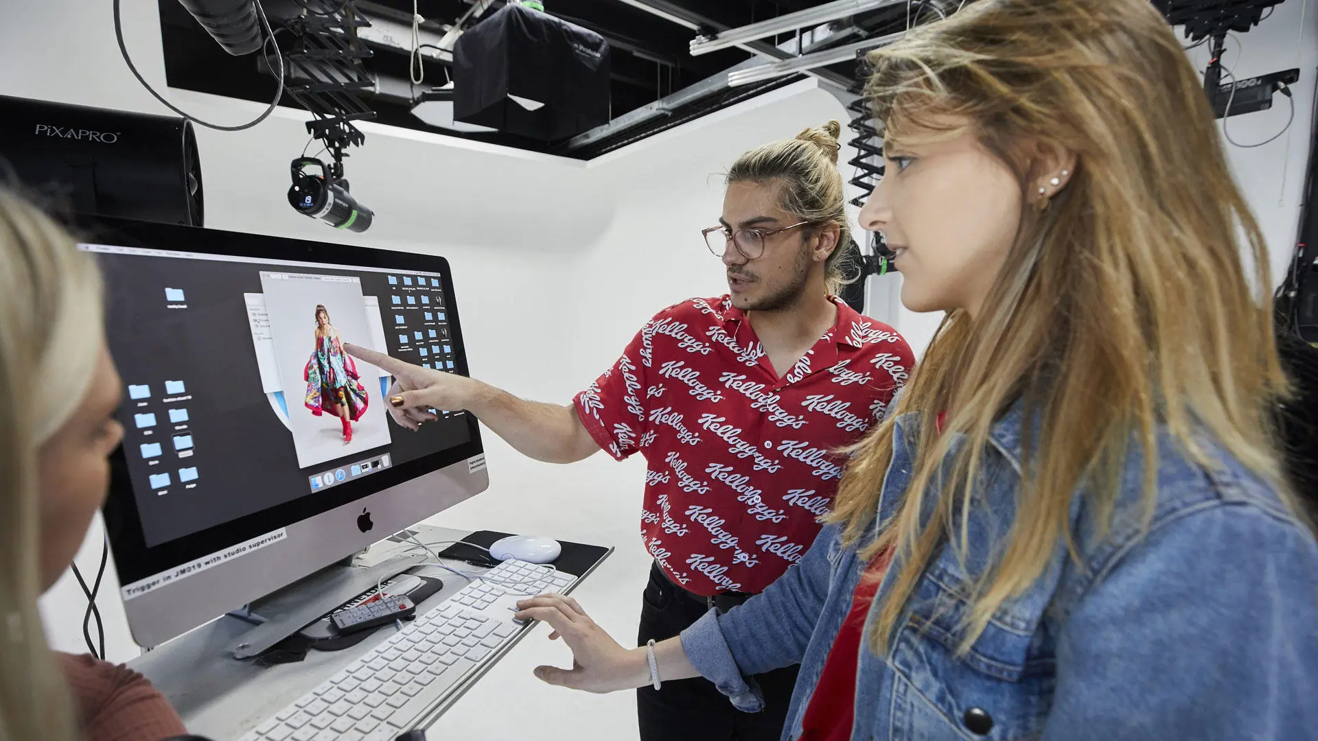 Students doing a photoshoot in the photography studio